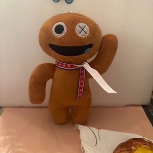Smiling Brown Plush Toy with Starry Scarf